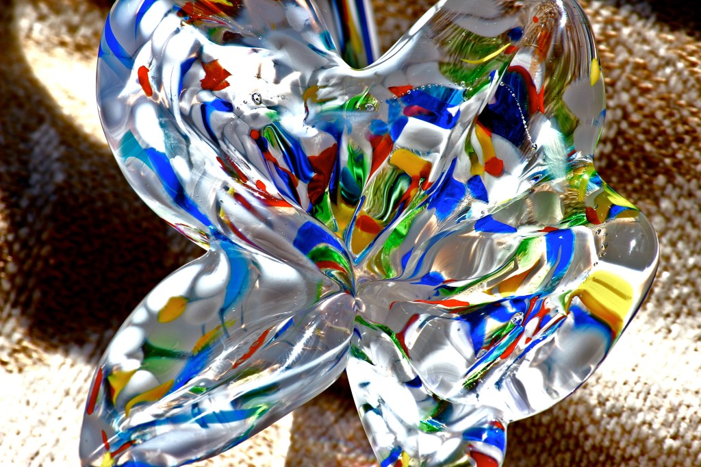 Tried to be conned into making something with much more pleasant symmetry-but I would not be foiled. I'm innately attracted to more odd and out-there things. Between petals and stem, was about a 15 minute process. Shot on my Canon T3i-55m-250 Canon lens.